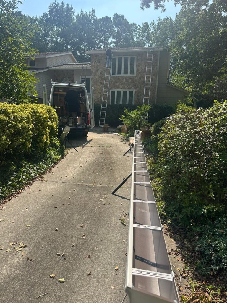 Transport vehicle carrying materials for gutter replacement and installation – Gutter Master