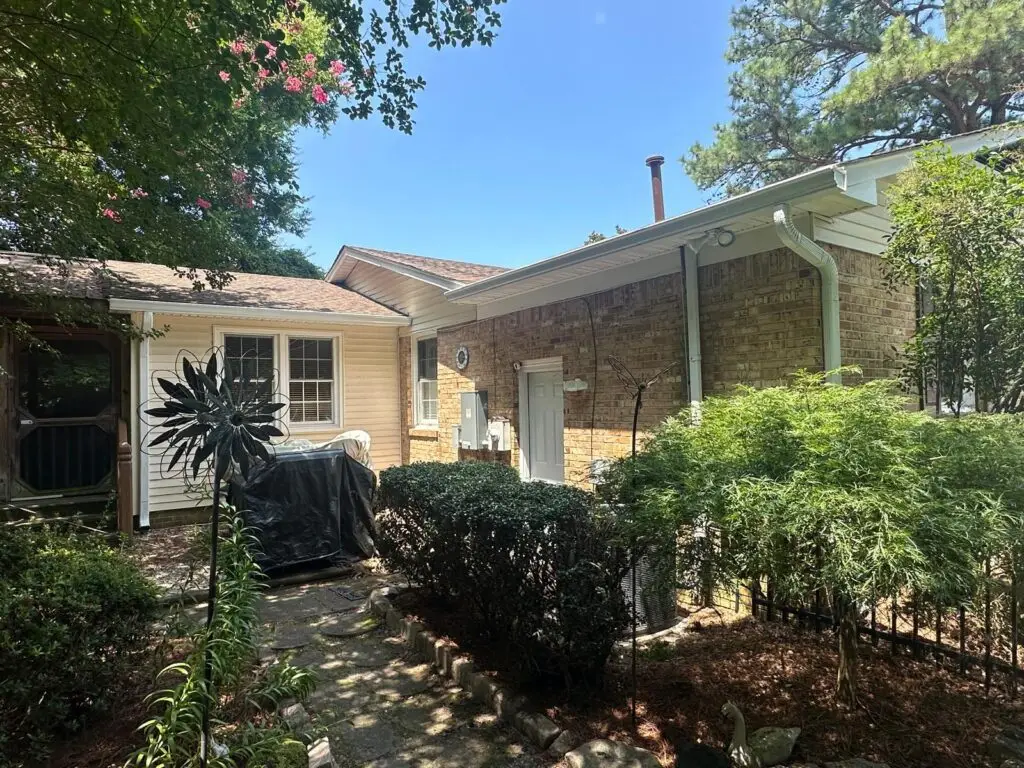 Virginia Beach home with new gutter installation to protect foundation and improve rainwater drainage.