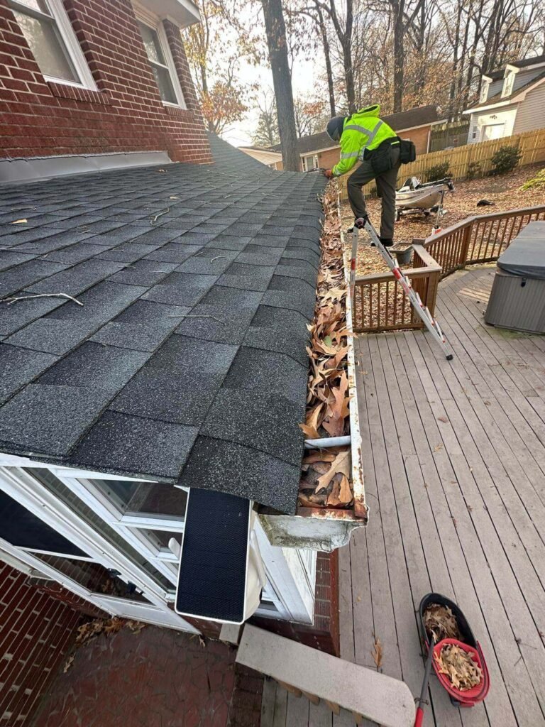 Clogged and damaged gutters before gutter replacement project in Chesapeake VA