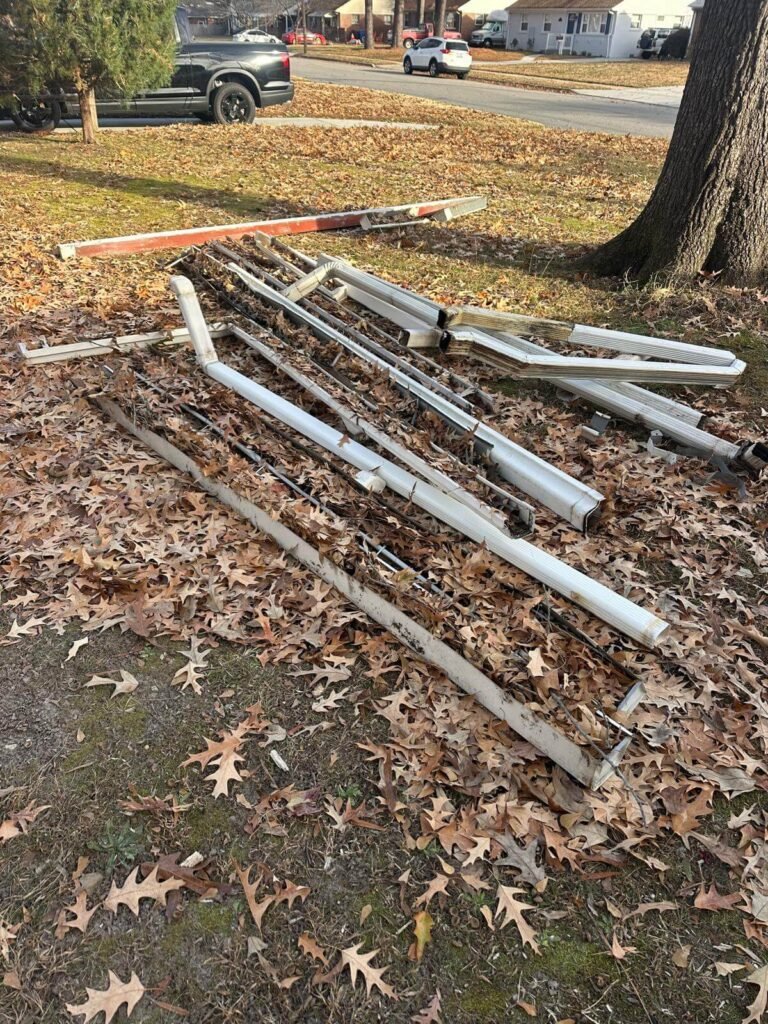 Removed old gutters and downspouts during gutter replacement project in Chesapeake VA