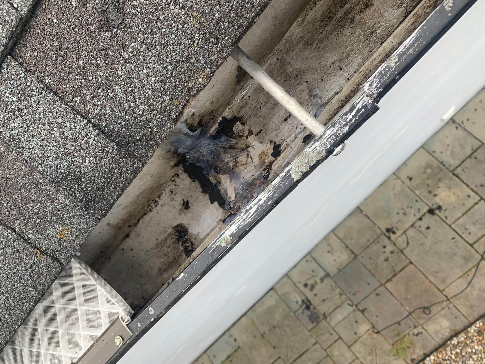 Leaking gutter seam with failed sealant in Virginia Beach