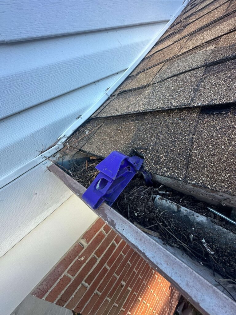 Debris buildup inside sectional gutter joints causing leaks before seamless gutter installation in Portsmouth Virginia