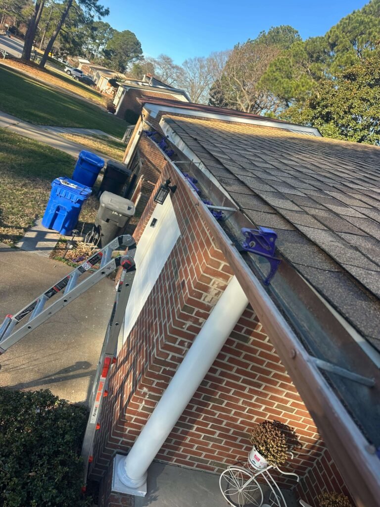 Sagging sectional gutters with joint failure inspected before seamless gutter replacement in Portsmouth VA