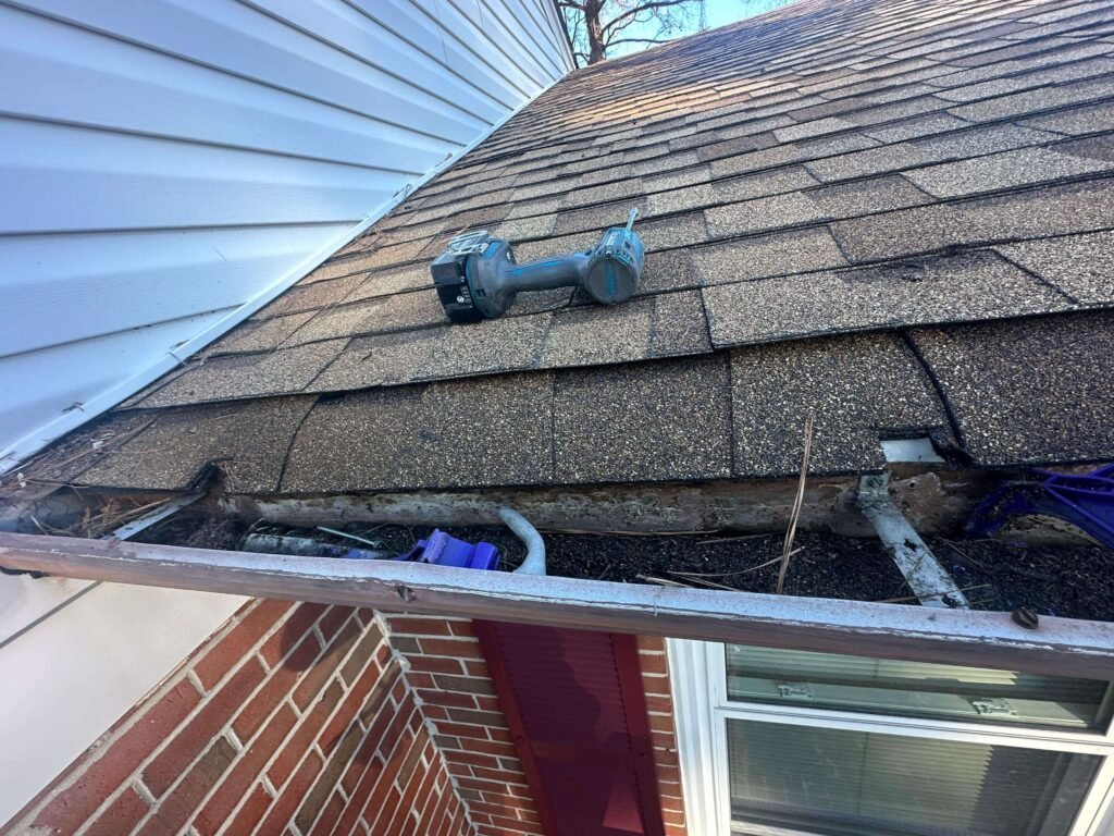 Gutter inspection and roof edge preparation during seamless gutter installation in Portsmouth VA