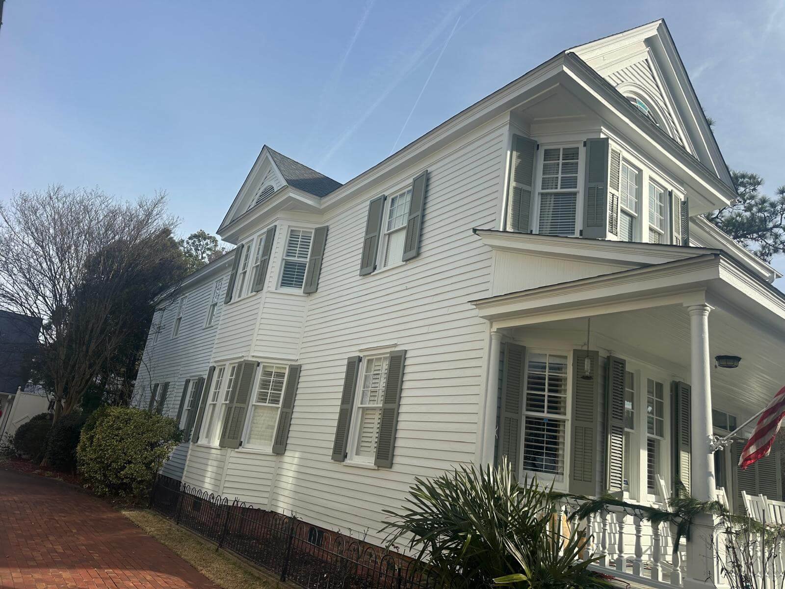 Two-story Virginia home fitted with custom seamless gutters for improved drainage and curb appeal.