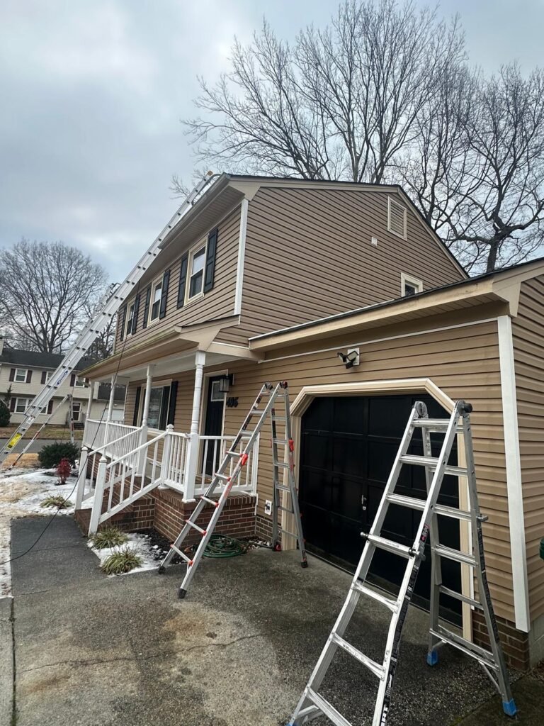 Professional seamless gutter installation in progress in Newport News Virginia