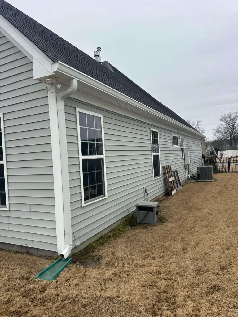 White seamless gutter system installed on single-story home in Chesapeake VA