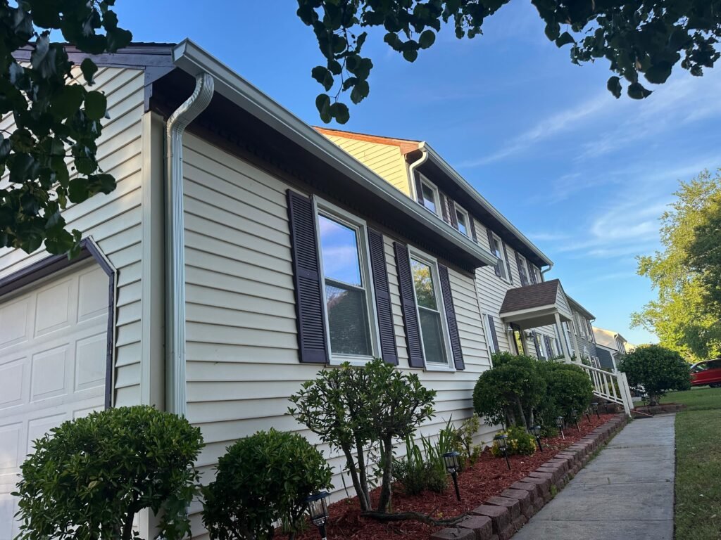 New seamless aluminum gutter installation Virginia Beach VA showing clean continuous run