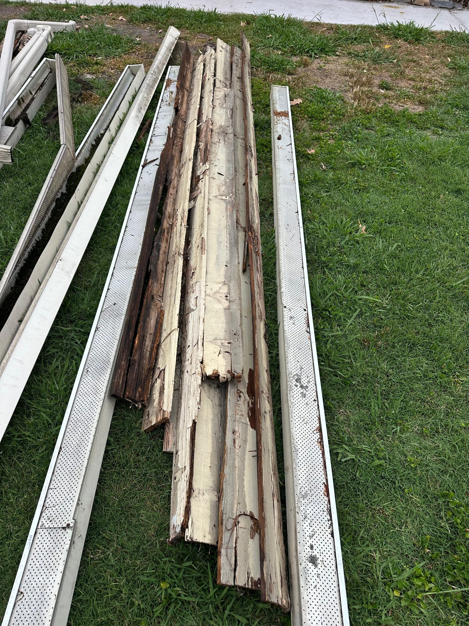 severely rotted fascia boards removed during gutter replacement Chesapeake VA — full structural wood deterioration visible