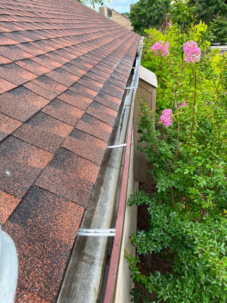 Clean second-story gutter after cleaning on a Virginia Beach home