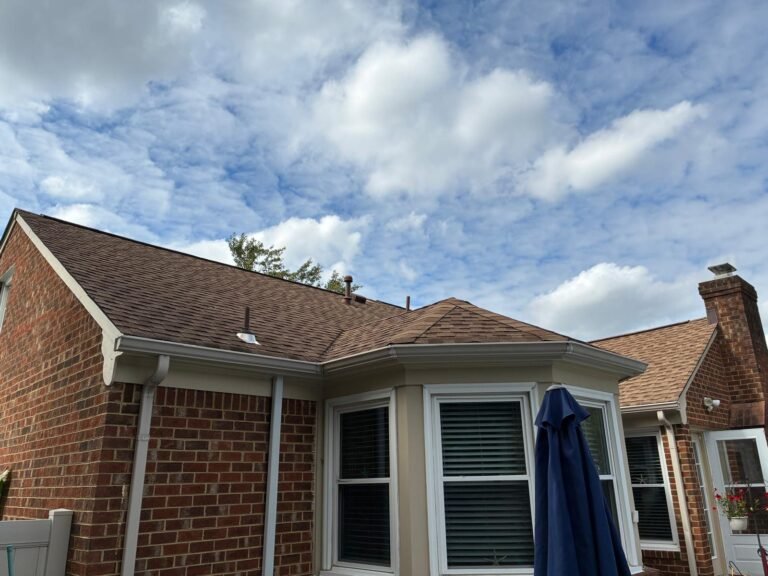 Finished rear roofline with cleaned gutters reinstalled over new fascia wrap in Chesapeake, VA