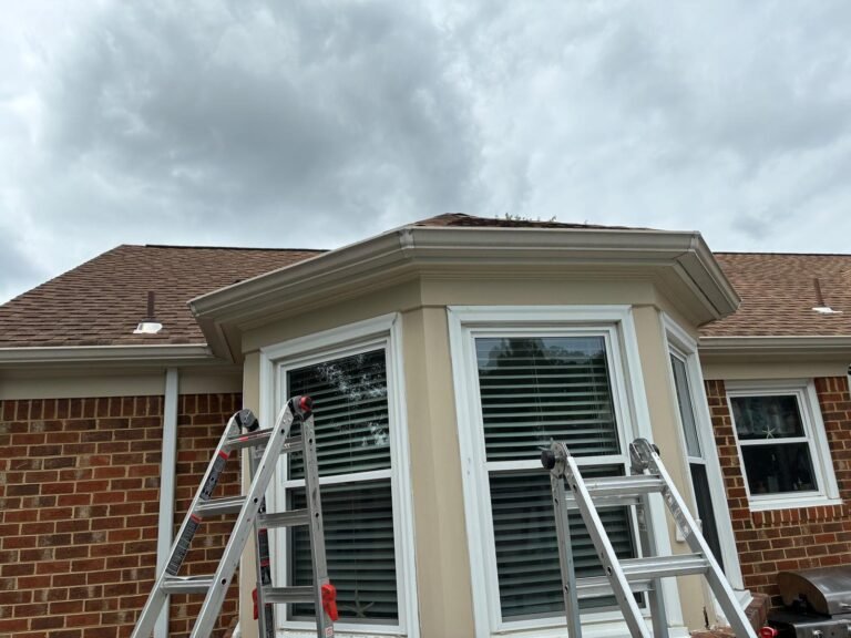 Finished side roofline with fascia wrap and reinstalled gutter in Chesapeake, VA