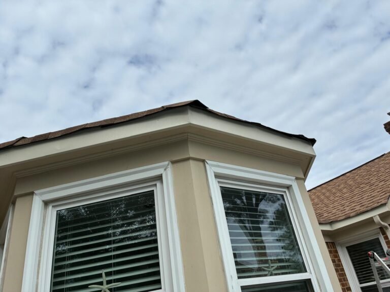 Newly installed aluminum fascia wrap on the bay window roofline in Chesapeake, VA