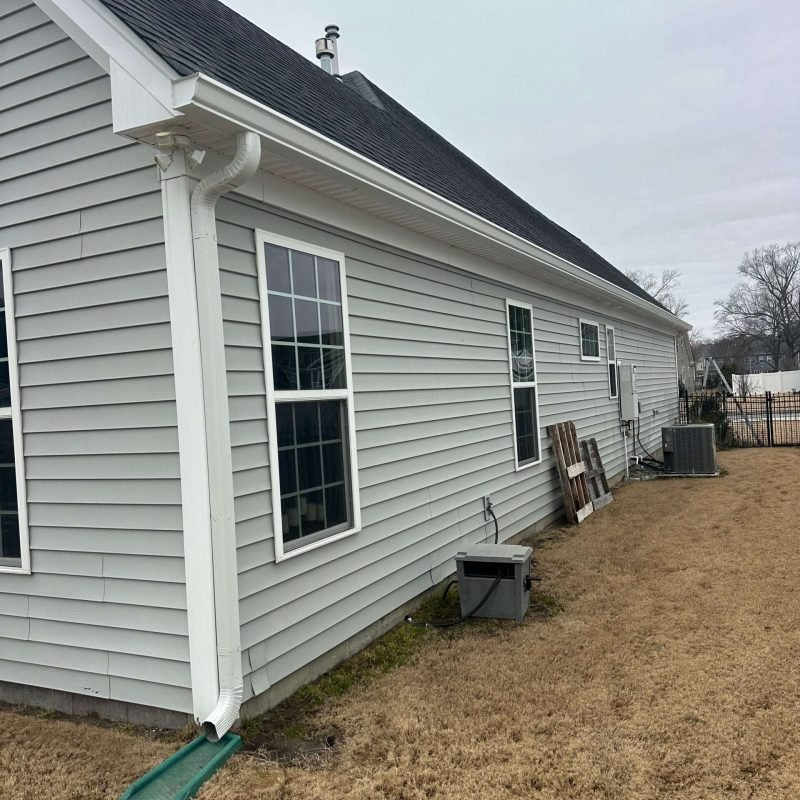 White seamless gutter system installed on single-story home in Chesapeake VA
