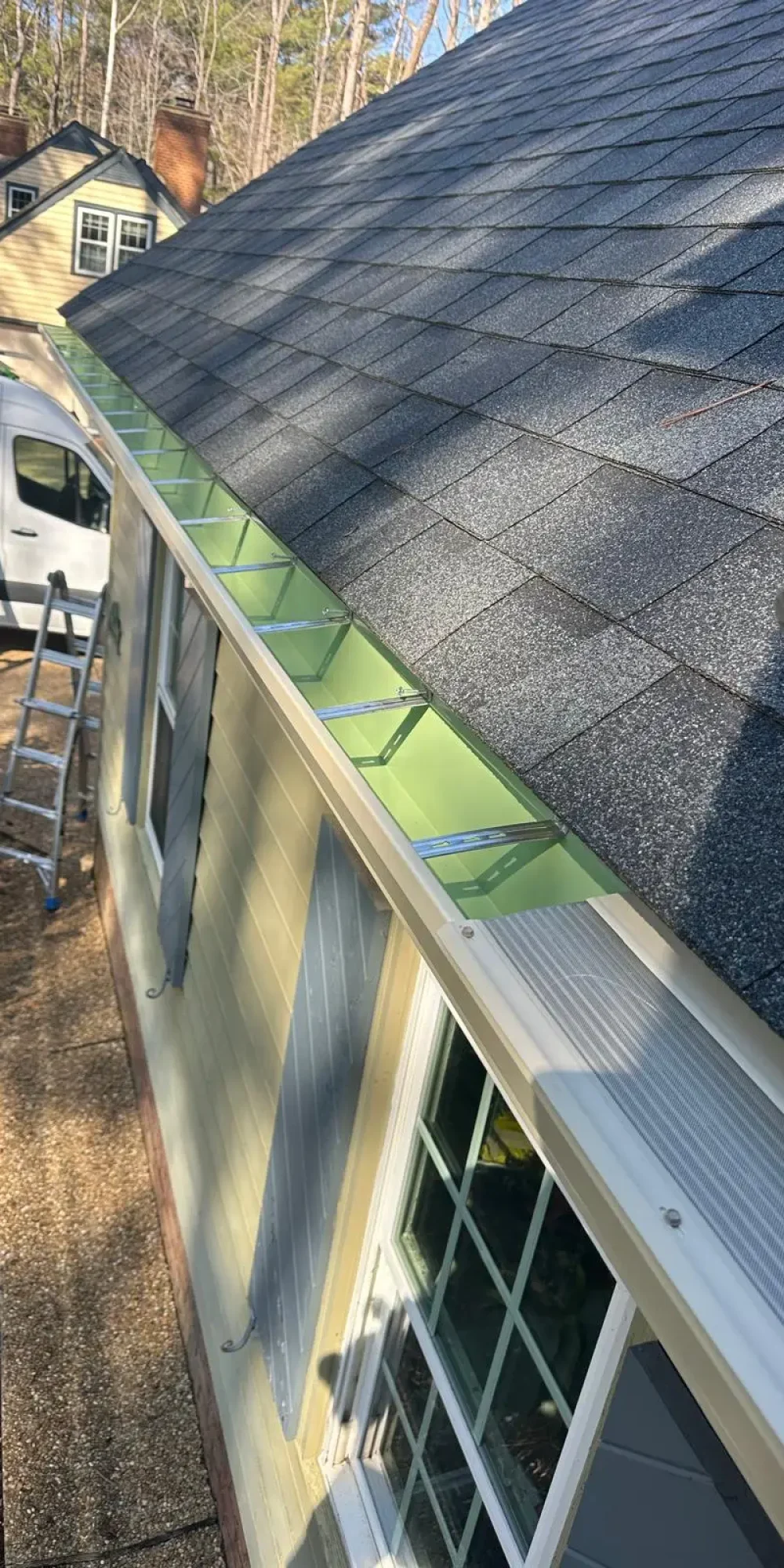 Replacing old gutters with new seamless gutter installation