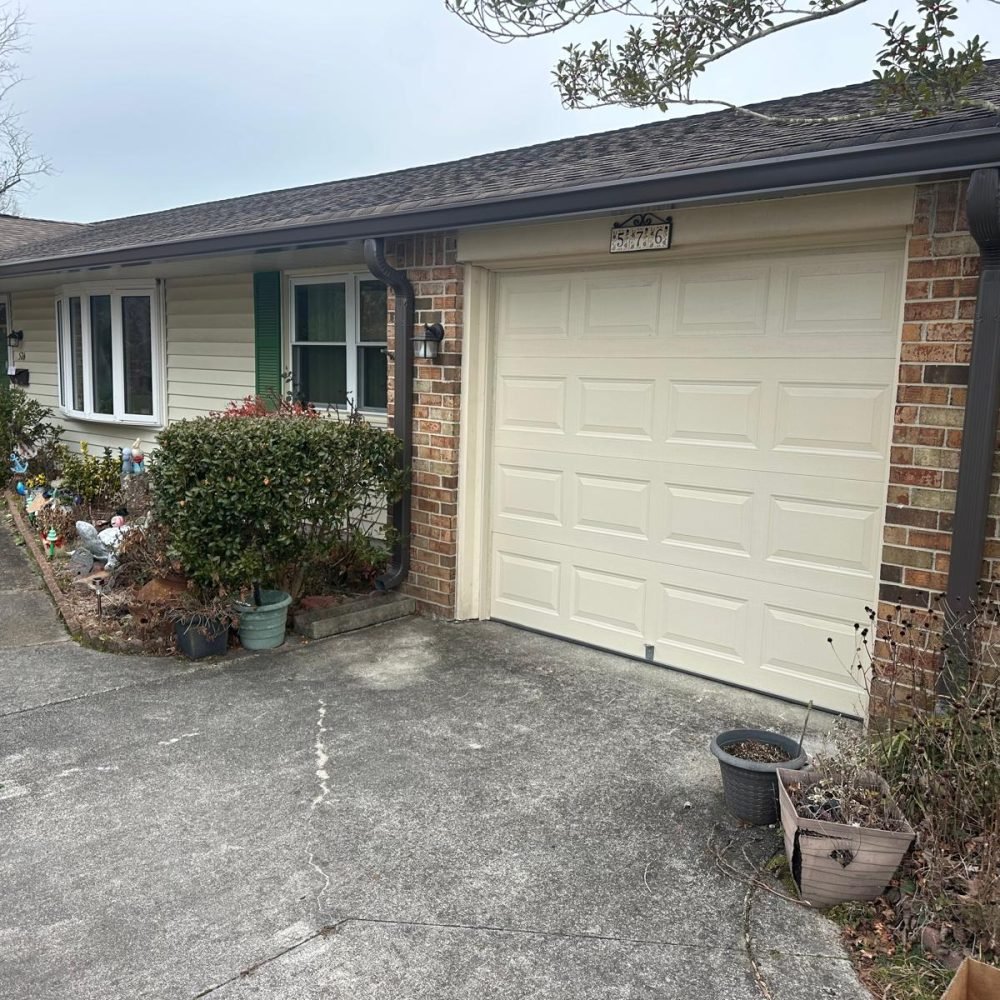 Modern aluminum gutter installation with downspout system