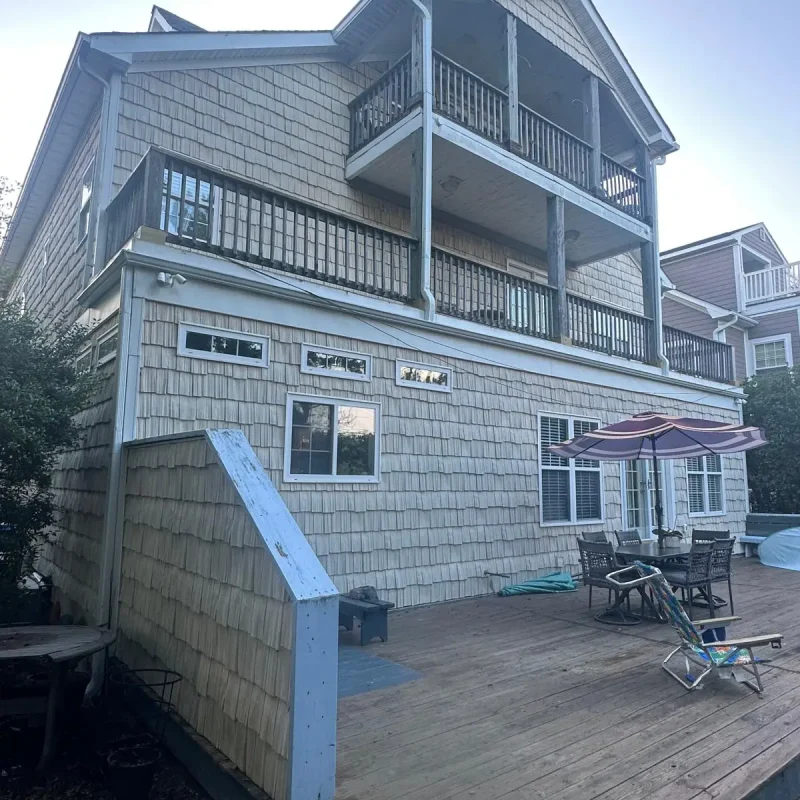 Seamless rain gutter installation on residential property with deck – Virginia Beach gutter experts