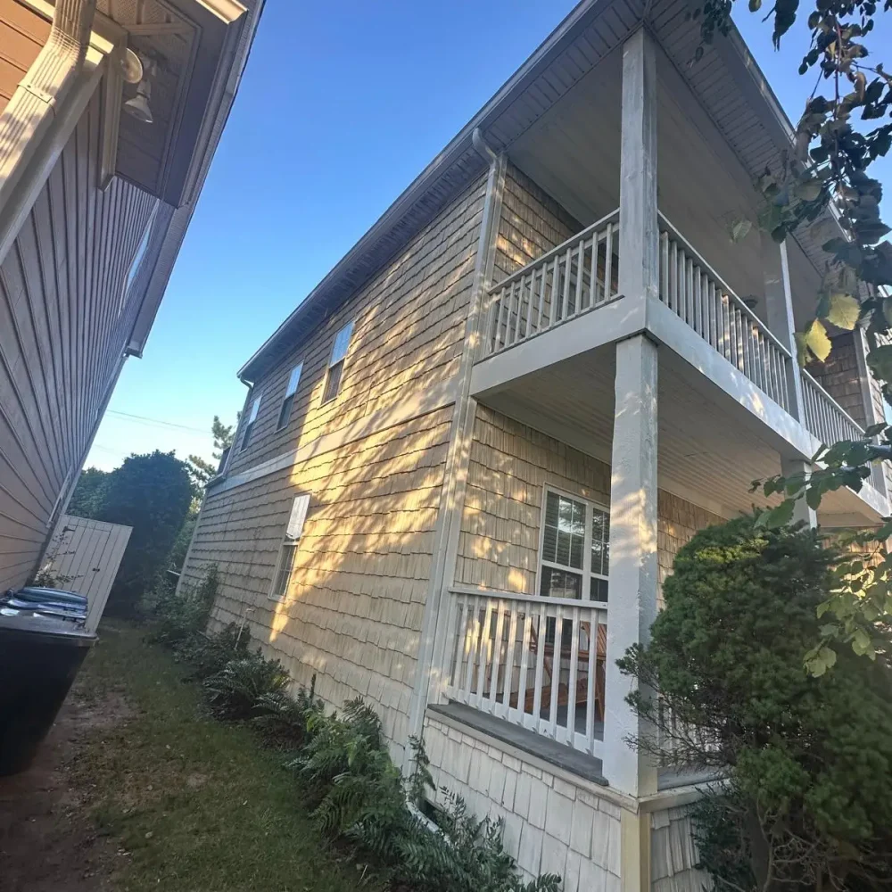 Virginia Beach multi-level property with new gutter system installation for stormwater protection.
