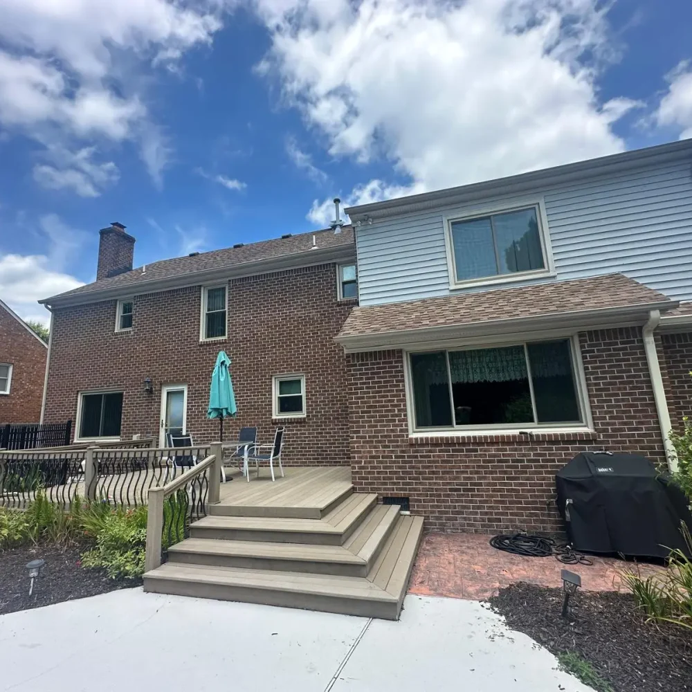 Norfolk brick home with gutter repair and installation services to ensure proper water flow and prevent leaks.