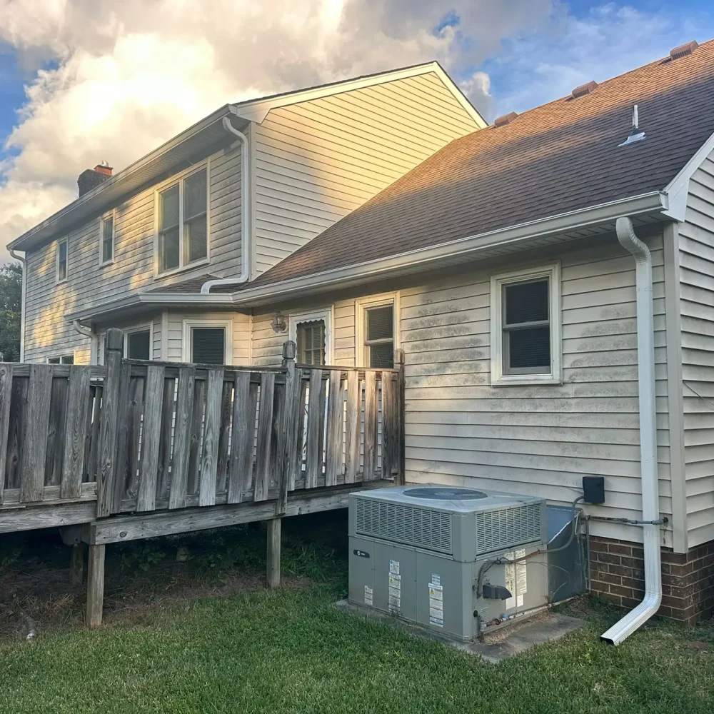 Complete gutter installation and repair on a multi-story house in Williamsburg ensuring safe drainage and roof protection.