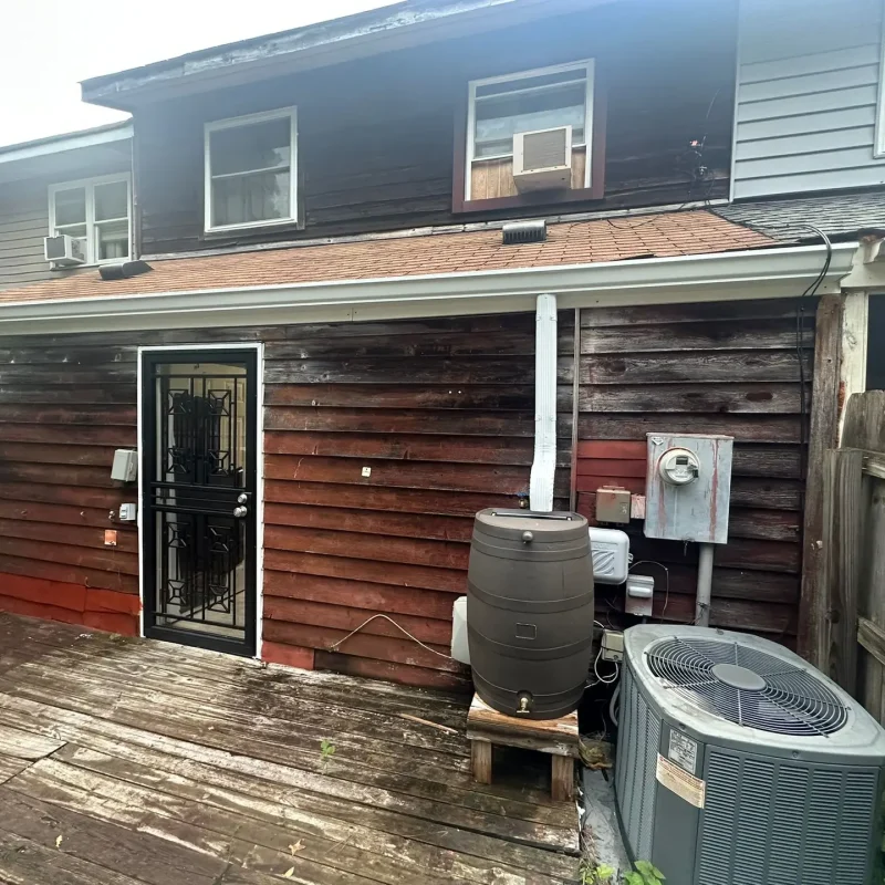 Backyard gutter repair and guard installation in Norfolk with strong, weather-resistant materials for improved drainage.