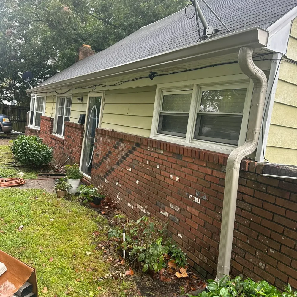 Expert gutter installation and filter system added to a brick house in Suffolk for efficient rainwater management.