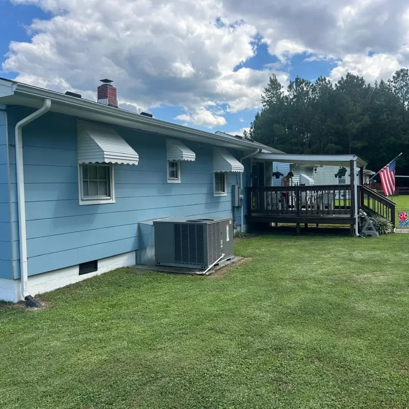 Seamless gutter installation in a Virginia farmhouse