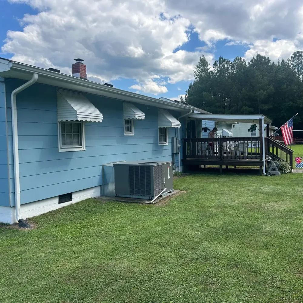 Seamless gutter installation in a Virginia farmhouse