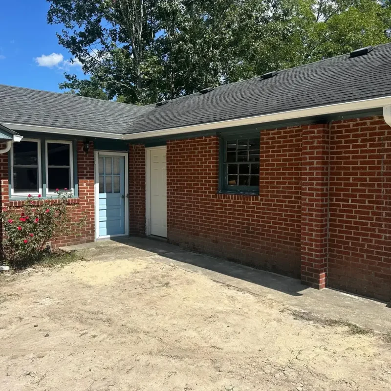 clear view of seamless gutter and downspout installation to prevent leaks in Newport News.