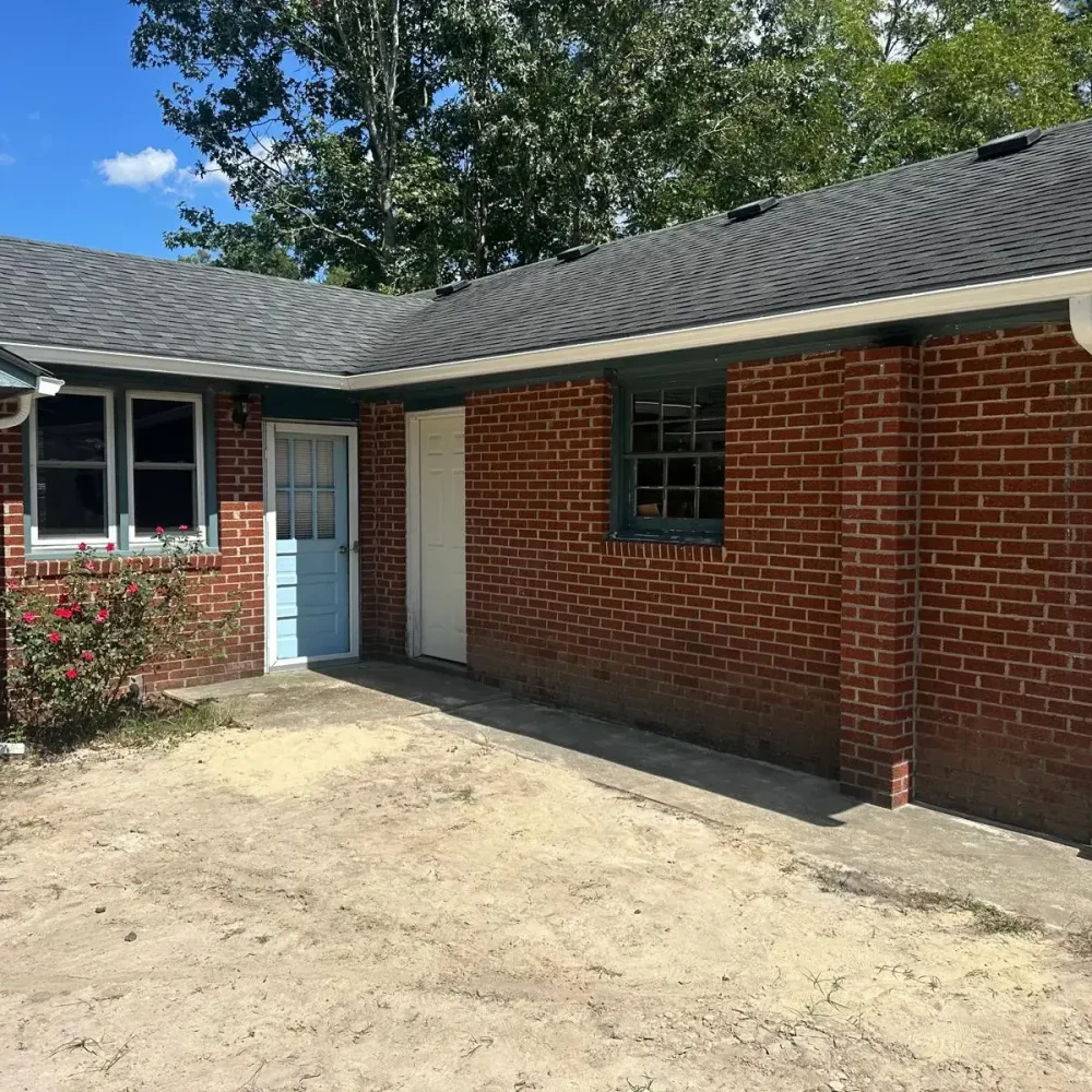 clear view of seamless gutter and downspout installation to prevent leaks in Newport News.