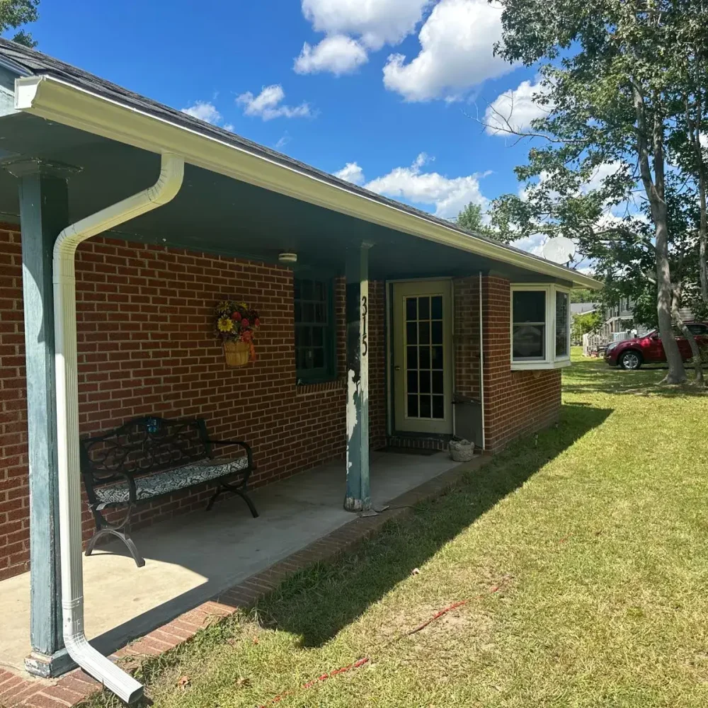 Close-up of seamless downspout installation to prevent leaks in Newport News.