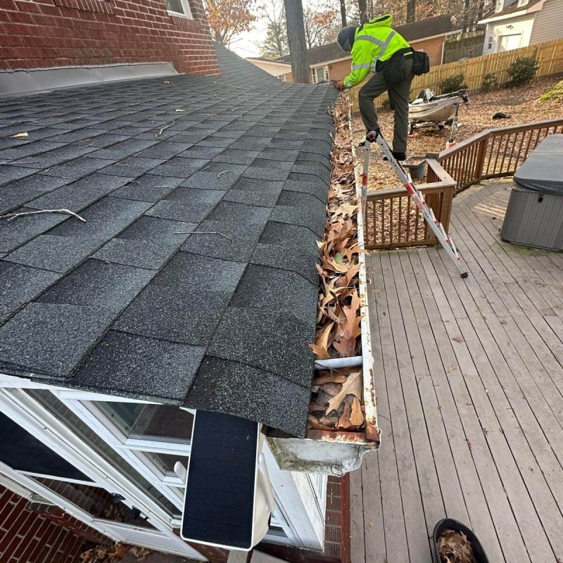 Gutter Installer taking off old sectional gutters