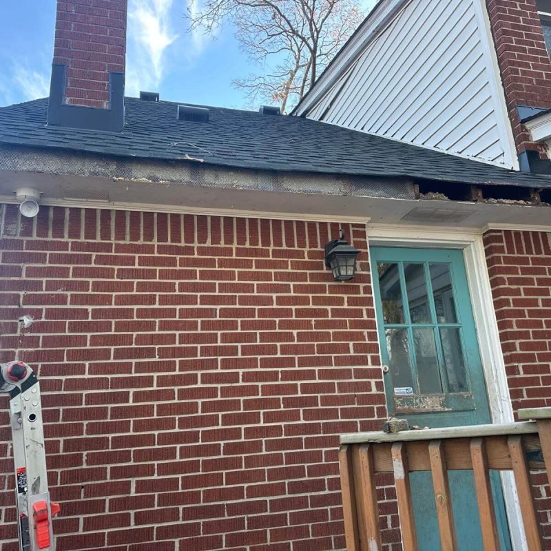 New seamless gutter installation after fascia repair on brick home in Chesapeake VA