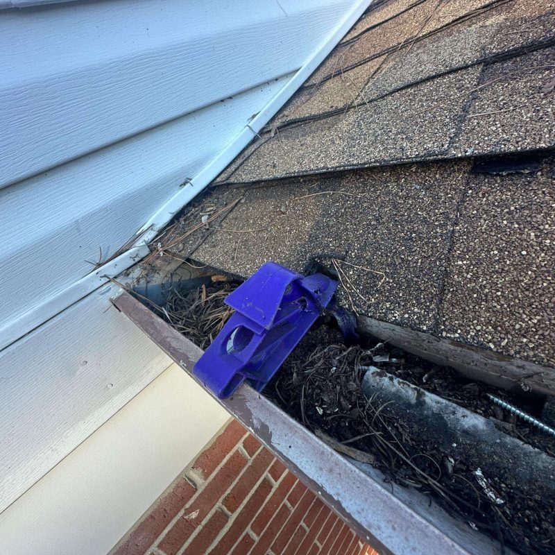 Debris buildup inside sectional gutter joints causing leaks before seamless gutter installation in Portsmouth Virginia