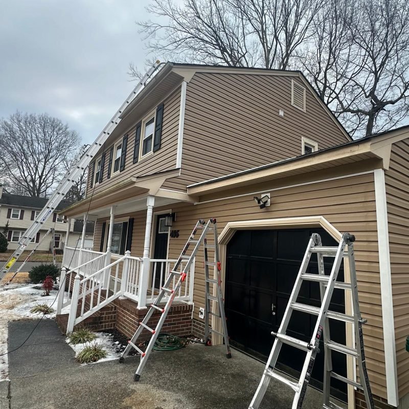 Professional seamless gutter installation in progress in Newport News Virginia